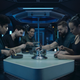 The crew of the Rocinante sits around a table sharing a meal in a scene from The Expanse.